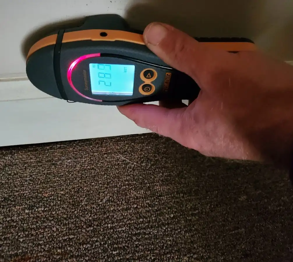 Moisture detection at baseboard during Storm Damage Restoration in Everman
